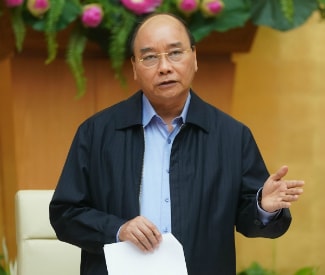 Thủ tướng Nguyễn Xuân Phúc phát biểu tại cuộc họp - Ảnh: VGP/Quang Hiếu