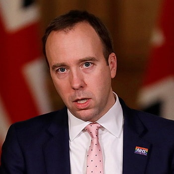 Bộ trưởng Y tế Anh Matt Hancock tại một cuộc họp báo ở London ngày 23/12. Ảnh: Reuters.
