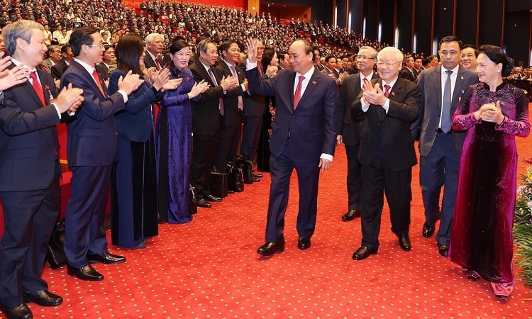 [Caption]Lãnh đạo Đảng, Nhà nước và các đại biểu dự Đại hội XIII tại phiên trù bị, sáng 25/1. Ảnh: TTXVN