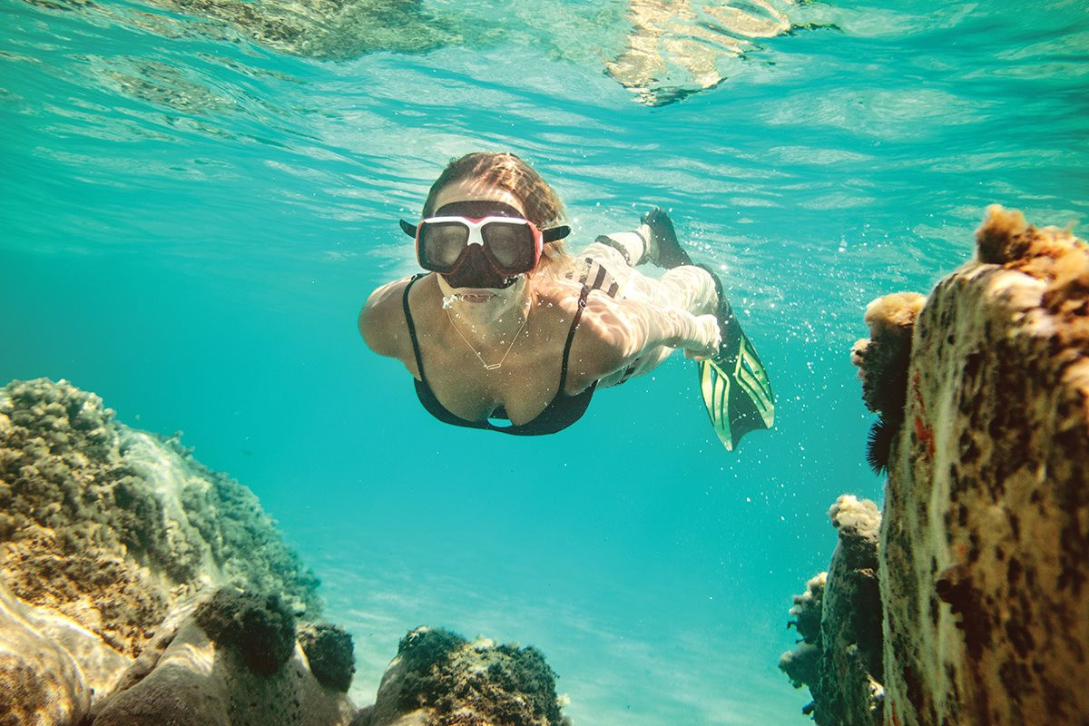 beautiful-young-woman-is-having-fun-summer-vacation-exploring-seafloor-during-scuba-diving-sea.jpg