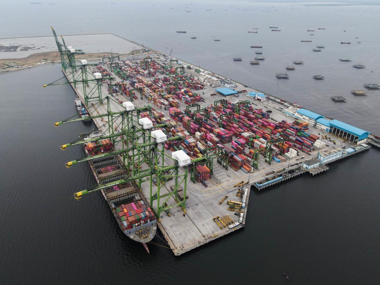 jakarta-indonesia-2021-aerial-view-of-container-ship-loading-and-unloading-in-deep-sea-port-import-and-export-freight-transportation-free-photo.jpg