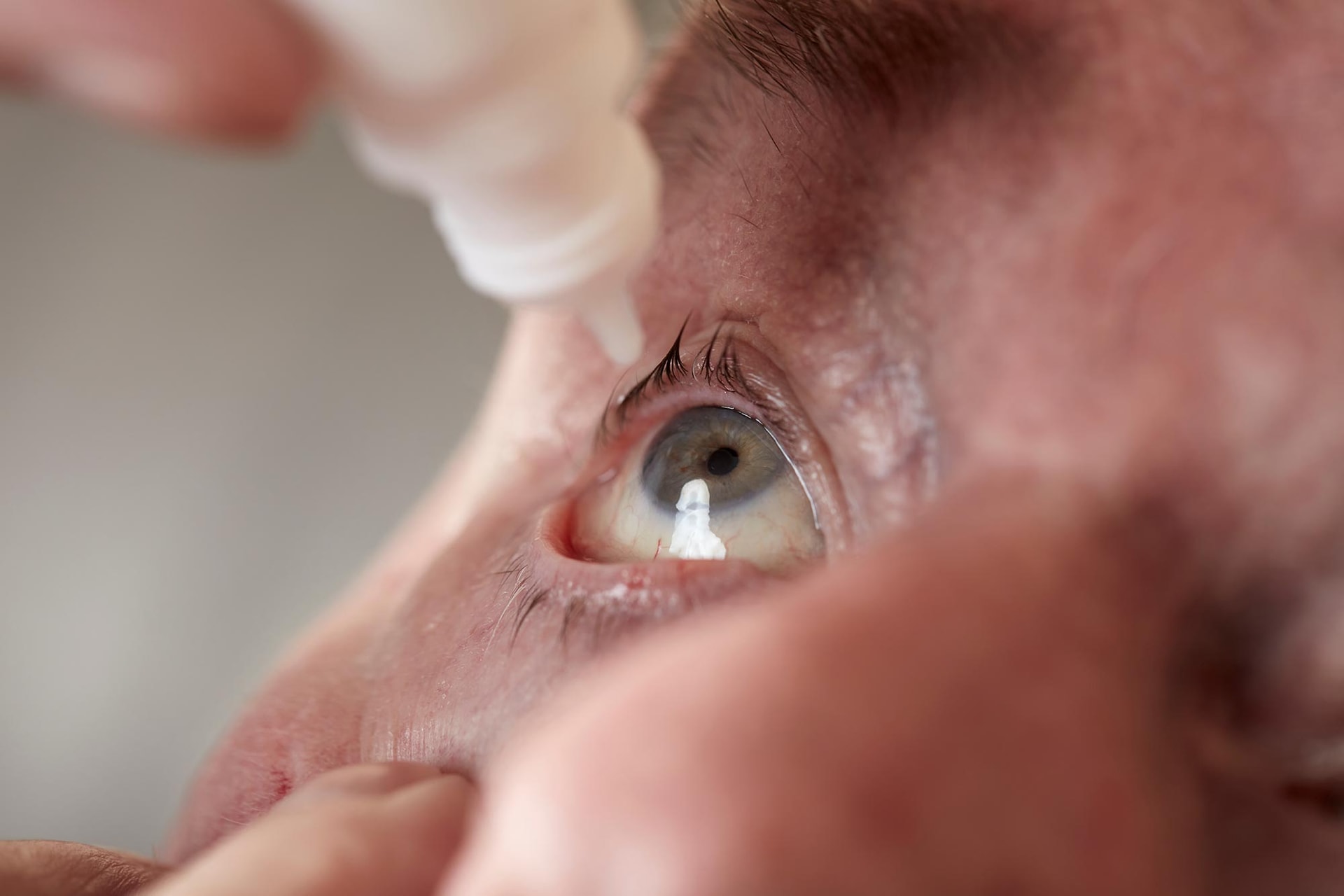 senior-man-eye-drops-close-up.jpg